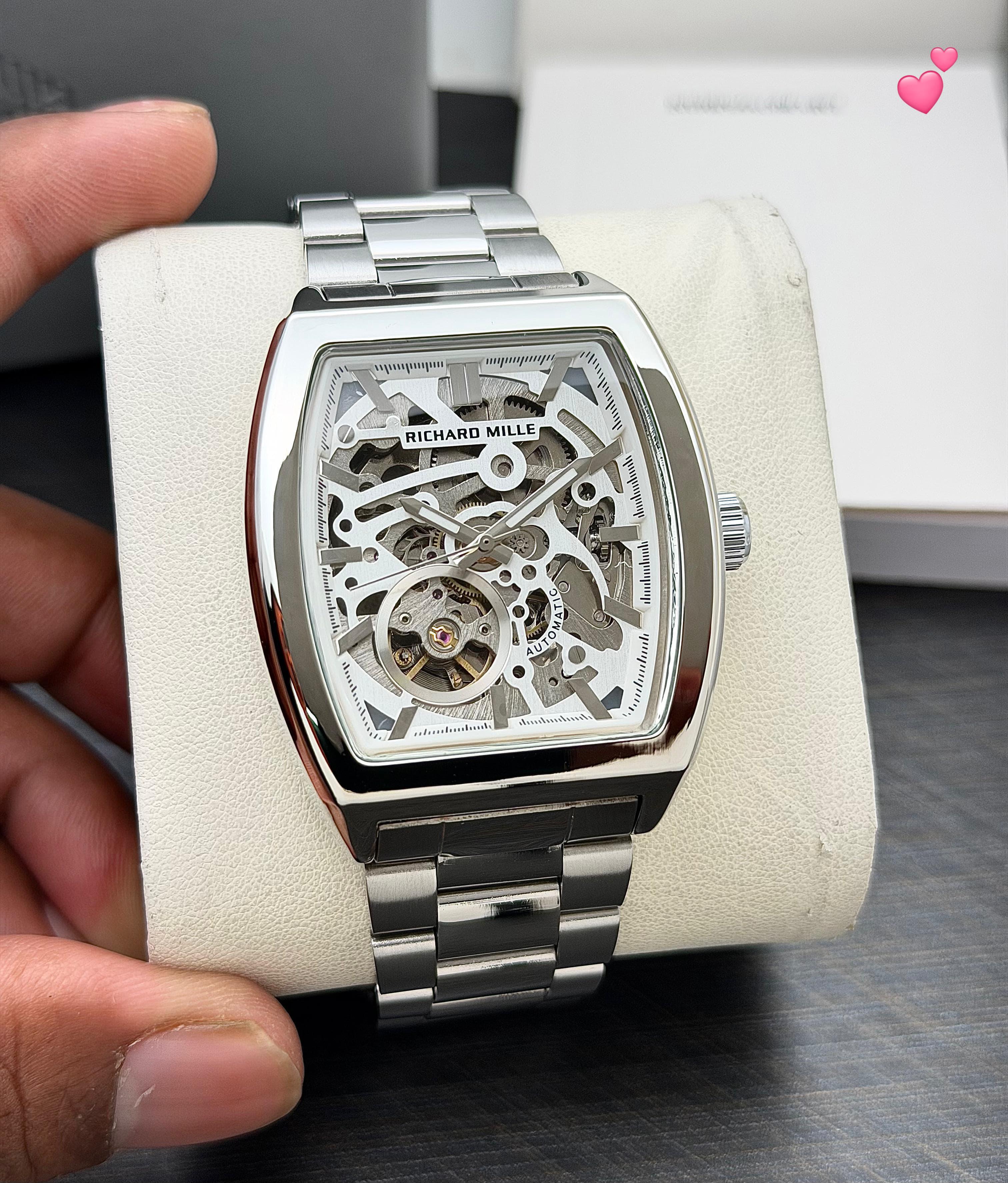 Richard Mille RM 010 Automatic model or a variation thereof. The RM 010 is known for its skeletonized design, tonneau-shaped case, and automatic winding movement.